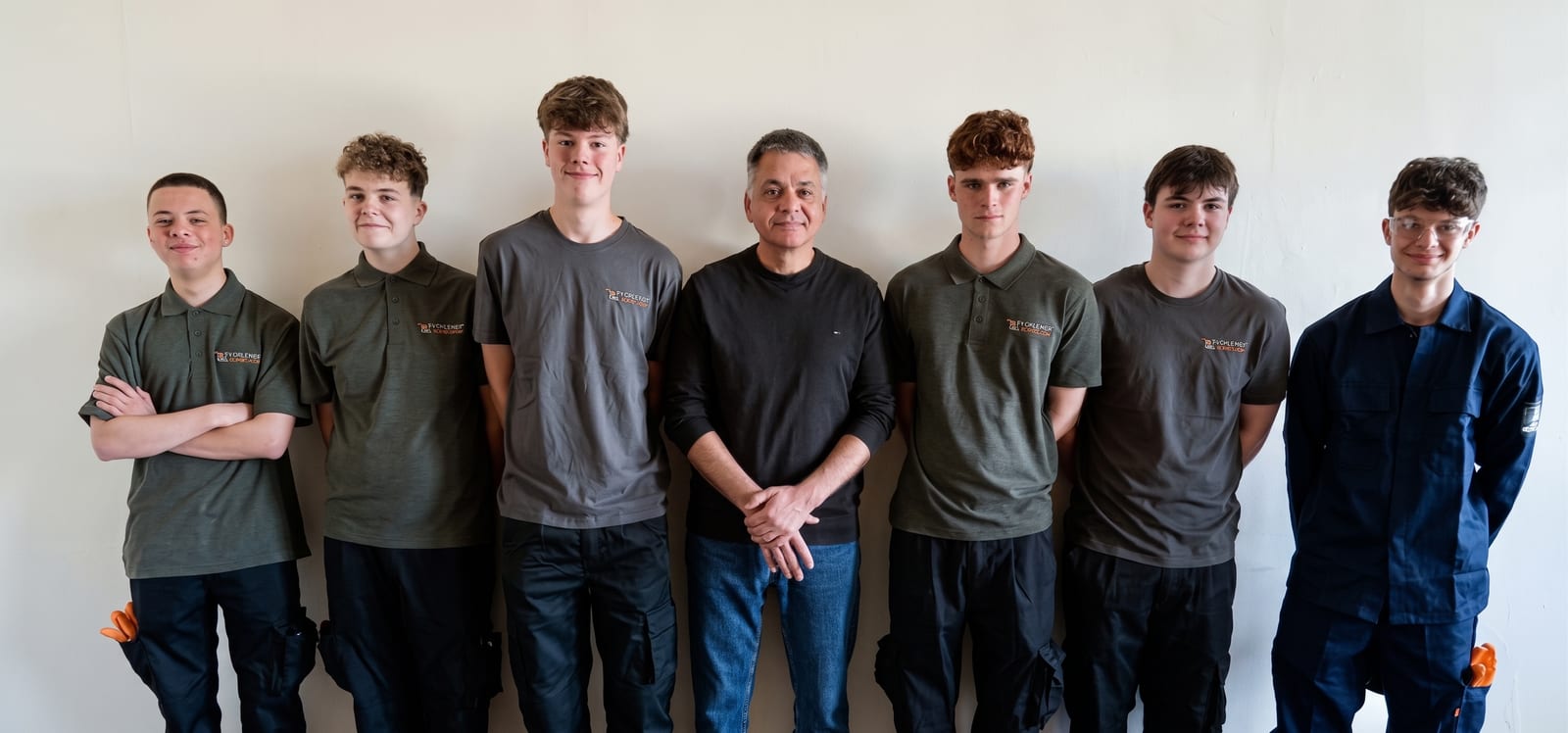 Giovanni Piazza, Managing Director of Timsons, standing with the six apprentices of the 2026 intake at the Kettering works